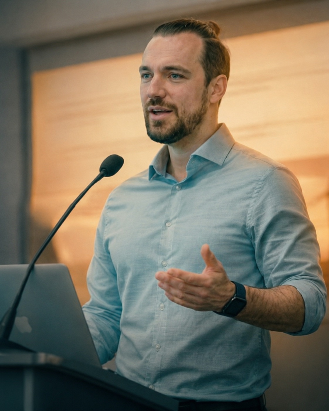 Sergey presenting at a podium during an engineering session